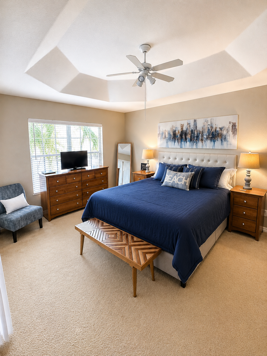 Master bedroom with king bed and coastal decor